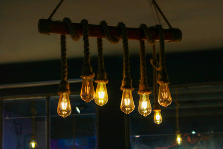 Rustic Industrial Pendant Light with Edison Bulbs Wrapped in Manila Ropeの写真素材