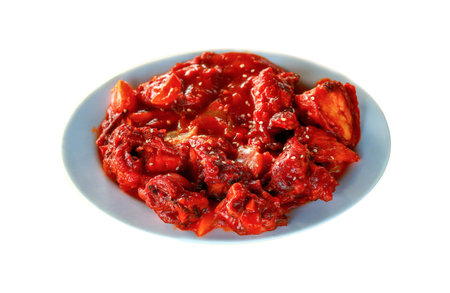 Spicy Chilli Chicken with Sesame Seeds Isolated on Whiteの写真素材