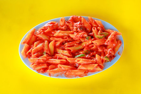 Delicious Penne Pasta in Spicy Tomato Sauce with Green Peppersの写真素材