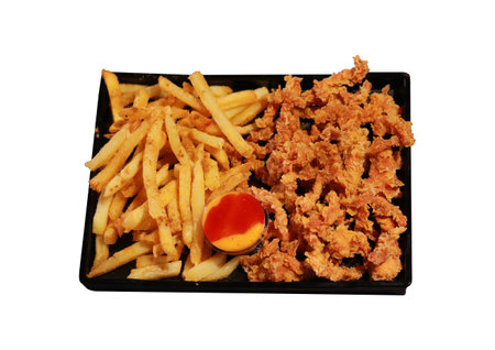 French Fries and Crispy Popcorn Chicken Combo with Dipping Sauceの写真素材
