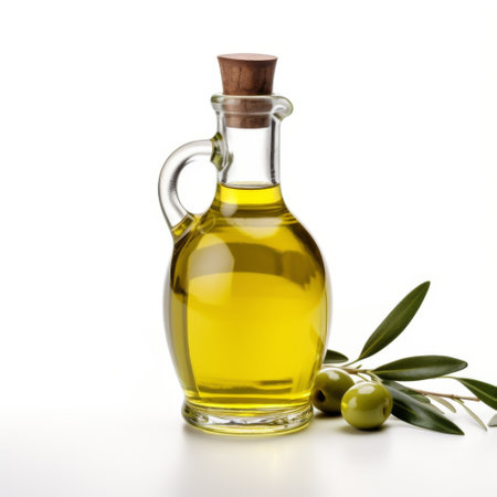 Olive oil in a glass bottle and olives on a white backgroundの素材