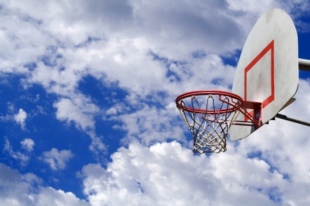 This is a basketball hoop with cloudsの写真素材