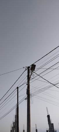 Electricity post and power lines in the city, Bangkok, Thailandの写真素材