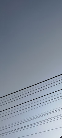 electricity post with blue sky and white cloud in the background.の写真素材