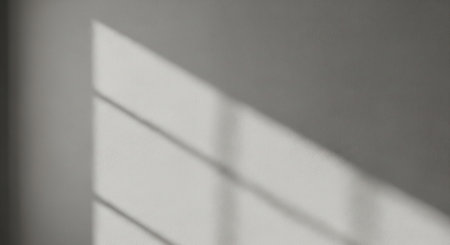 Shadow from window on white wall. Abstract background for design and decoration.の写真素材