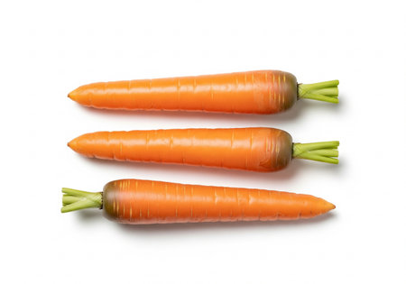 Fresh carrots isolated on white background, top view. Vegetable backgroundの写真素材
