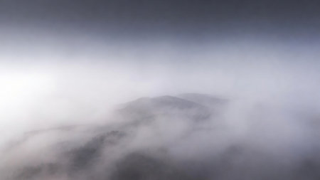 Panoramic view of the foggy mountains in the morning.