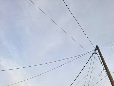 electricity post with blue sky background, power line and blue sky