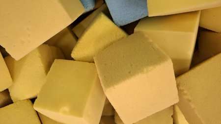 Close-up of yellow and blue sponges for washing dishes