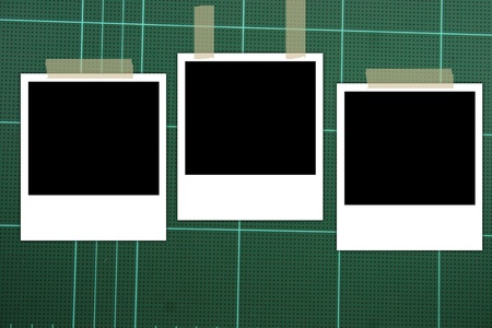 photo frame on green board background の写真素材
