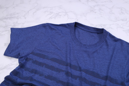 Blue stripe tshirt on marble backgroundの写真素材