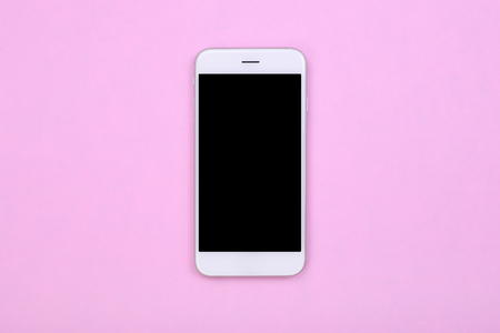 Top view mockup smartphone on pink pastel backgroundの写真素材