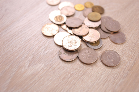 Hong Kong dollar coins on wooden backgroundの写真素材