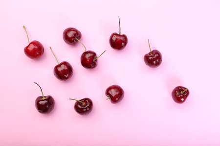 Fresh cherry on pink pastel background