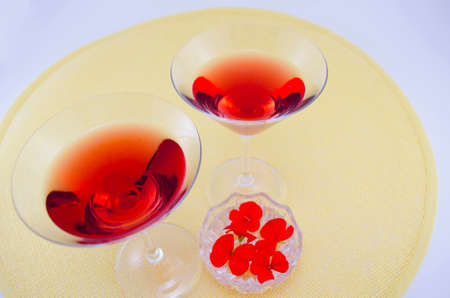 Two martini glasses filled with red drinkの写真素材