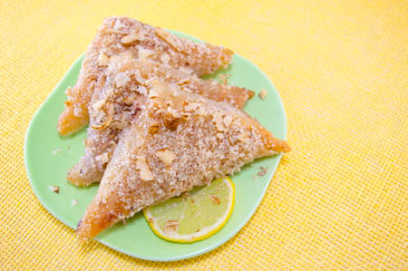 Triangle shaped Turkish Baklava on a plateの写真素材
