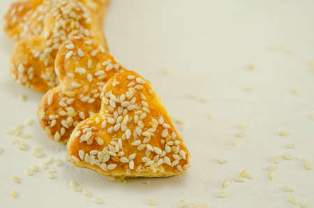 Salty heart shaped sesame crackersの写真素材