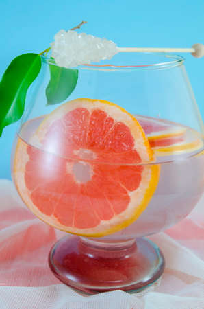 Dietary fruit cocktail of grapefruit and lemon juice in a jar with sugar stickの写真素材