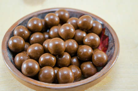 Shiny chocolate balls in a plateの写真素材