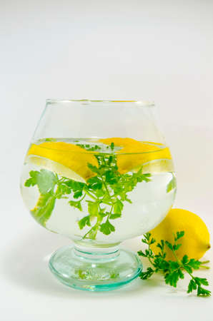 Fresh lemons and parsley in a jar, ready for your dietの写真素材