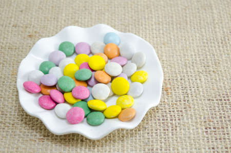 Funny small small chocolates balls in a plateの写真素材