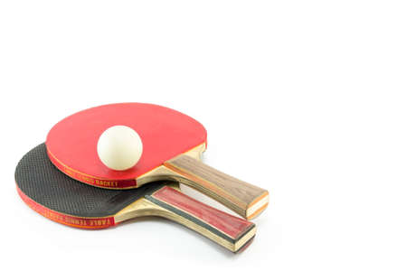 Two ping-pong rackets and a ball isolatedの写真素材