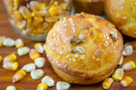 Delicious golden colored corn bread with sesame on a table