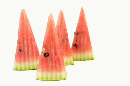 Conical fresh watermelon slices isolated on white backgroundの写真素材