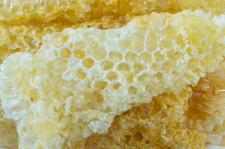 Healthy natural fresh honeycombs stacked forming background