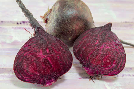 Whole and sliced beetroot on the wooden table