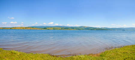 Panoramic view at the lake on a sunny dayの写真素材