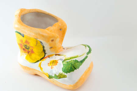 Decoupage decorated vintage porcelain figurine on white background. Decoupage technique demonstrationの写真素材