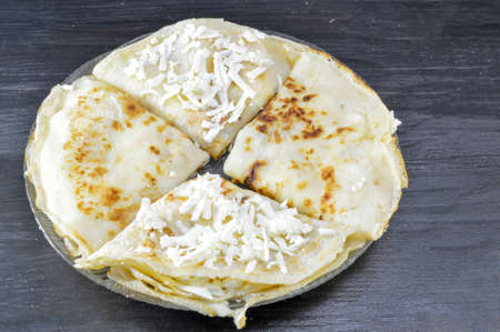 Homemade pancakes with cheese and served on the plate