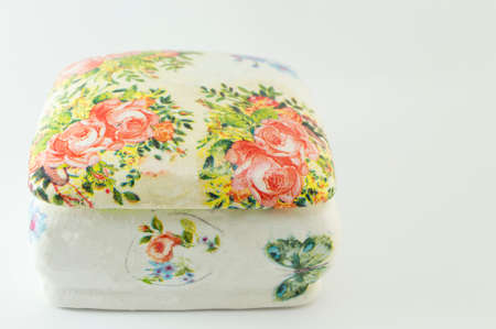 Decoupage decorated closed vintage jewelry box on white backgroundの写真素材
