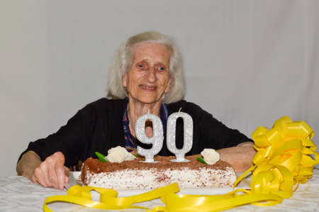 Mixed feelings of a grandma celebrating her 90th birthdayの写真素材