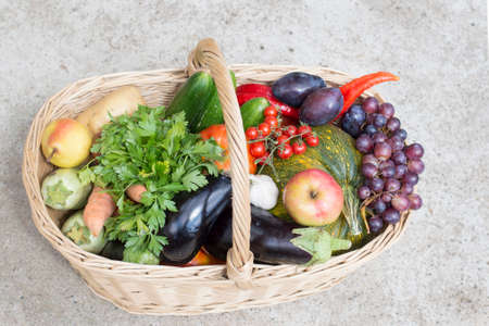 Large wooden  basket full of fruit and vegetablesの写真素材