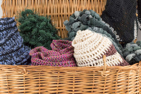 Winter accessories in a wooden basket ready for cold weather