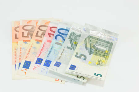 Various Euro bills placed on a white backgroundの写真素材