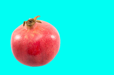 Juicy pomegranate on composite colored backgroundの写真素材