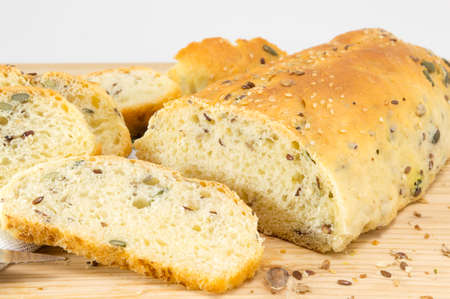 Sliced fresh and healthy homemade bread with seeds on the table
