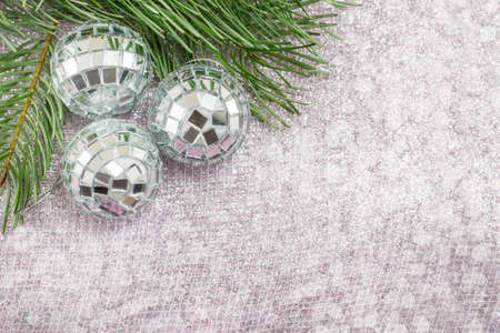 Christmas decoration and fir tree on sparkling background. Celebrating Christmasの写真素材