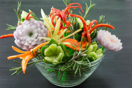 Homemade unique flower shaped vegetables salad served in a bowlの写真素材