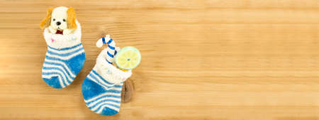 Christmas presents in socks 8by3 banner with wooden background