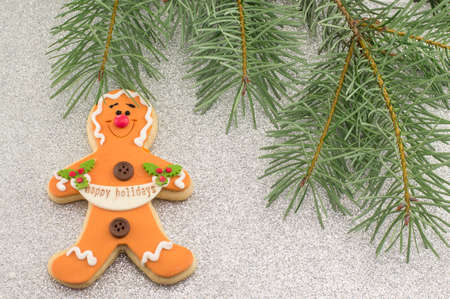 Christmas decoration with gingerbread cookie and fir tree