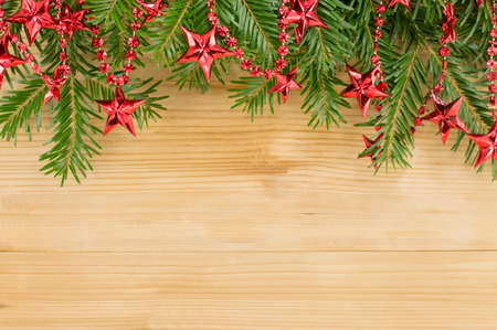 Christmas background with red ornaments and fir treeの写真素材