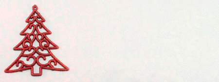 Red Christmas tree decoration on red backgroundの写真素材