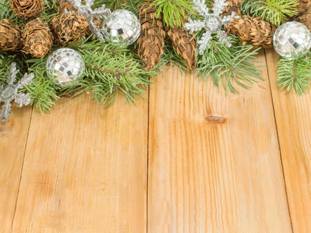 Festive Christmas ornaments and fir tree background