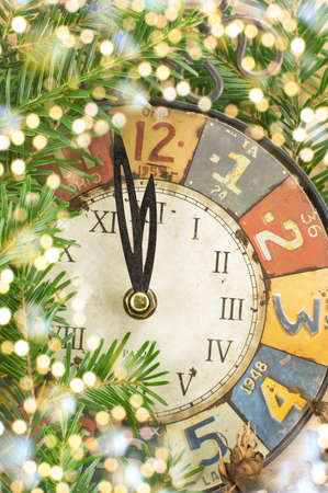 Vintage clock and shiny holidays lightsの写真素材