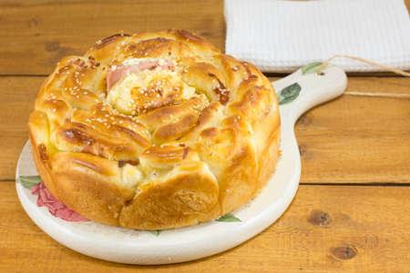 Special ham and cheese bread on a cutting board