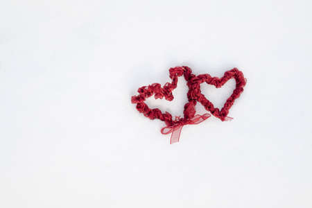 Heart shaped decoration on snow background outdoors. Winter love
